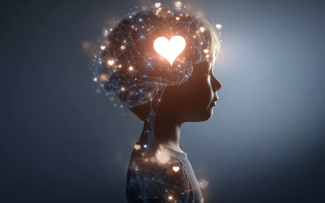 Une silhouette d'enfant montrant un coeur lumineux dans son cerveau et son système nerveux comme étant un réseau de connexion numérique